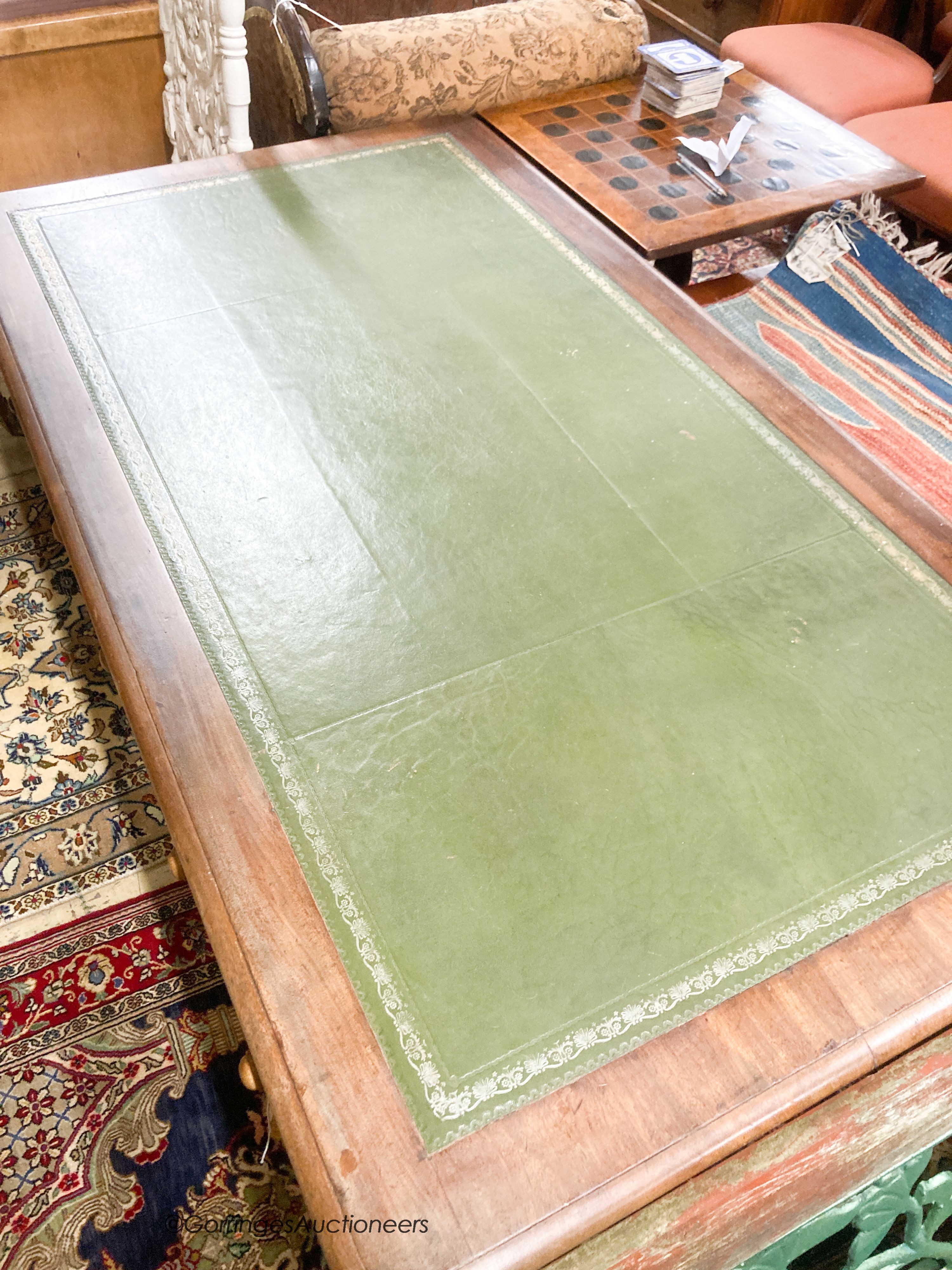 A Victorian mahogany three drawer writing table, width 150cm, depth 82cm, height 75cm